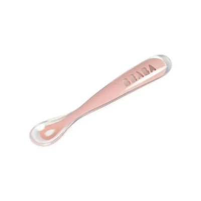 Self-feeding silicone spoon in pink by Beaba, featuring a soft tip for gentle gums and an ergonomic design for small hands.