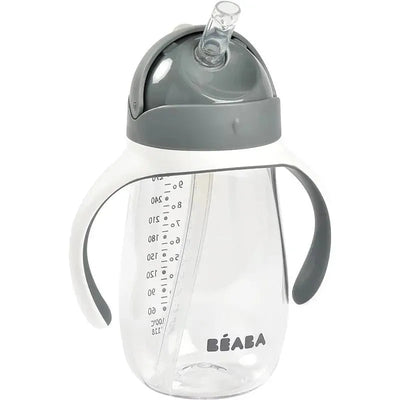 Beaba Straw Sippy Cup in charcoal with a clear body, measuring scale, and ergonomic handles.