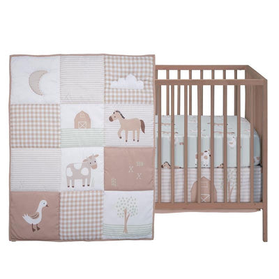 3Pk Farmyard Friends infant bedding set featuring a quilt with animals and a crib fitted sheet with cow prints.