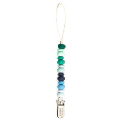 Bella Tunno Boy Multi Pacifier Clip with a variety of textured beads in blue and green hues, featuring a secure clip.