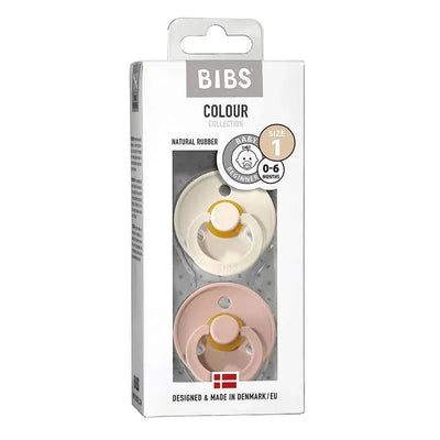 Blush and ivory baby pacifiers made from natural rubber, suitable for ages 0-6 months, packaged in a box.