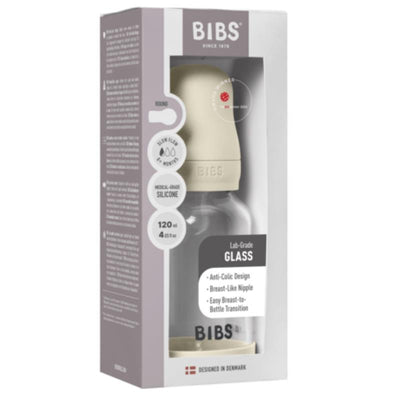 Silicone glass baby bottle with bumper, featuring a beige lid, 120 ml capacity, and anti-colic design, packaged in a box.