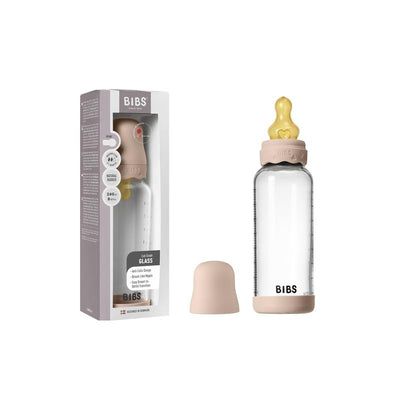 8 oz Bibs baby glass bottle with blush bumper and yellow rubber nipple, displayed with packaging.