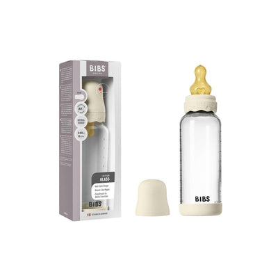 BIBS baby 8oz glass bottle with ivory bumper and silicone nipple displayed beside its packaging.