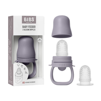 Baby feeder in fossil grey with two silicone nipples, designed for infants 4+ months, packaged in an illustrated box.