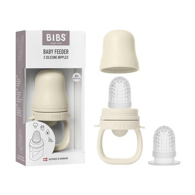 Bibs Baby Feeder in ivory with two silicone nipples, designed for babies 4 months and older, packaged in a box.
