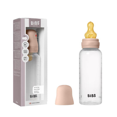 Baby plastic bottle with a blush-colored lid and latex nipple, featuring a clear design and 270ml capacity.