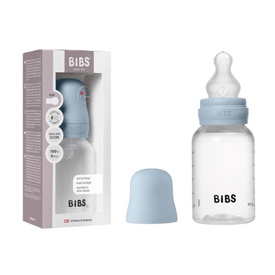Baby blue plastic bottle with silicone nipple, 150ml capacity, includes a protective cap and packaging detailing anti-colic design.