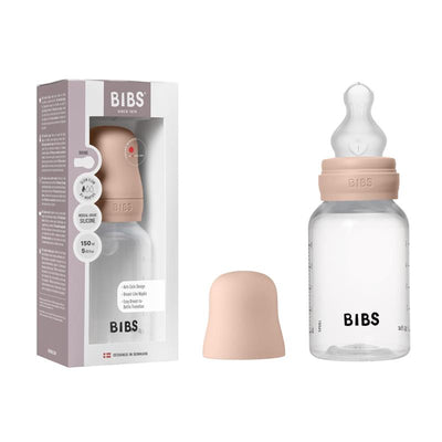 Bibs baby bottle in blush with silicone nipple, 150ml capacity, displayed with packaging and lid.