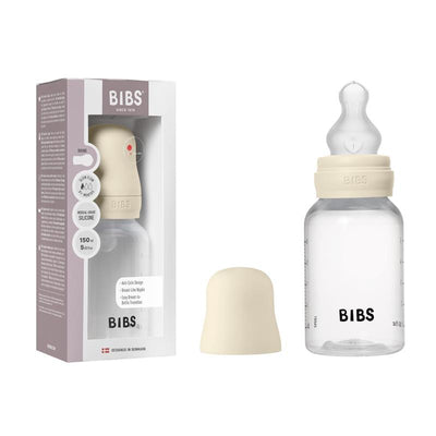 Baby bottle with silicone nipple, 150ml capacity, ivory color, alongside its packaging featuring brand name BIBS.