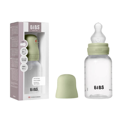 Baby plastic bottle with silicone nipple, 150ml capacity, in sage color, displayed with packaging and a cap.