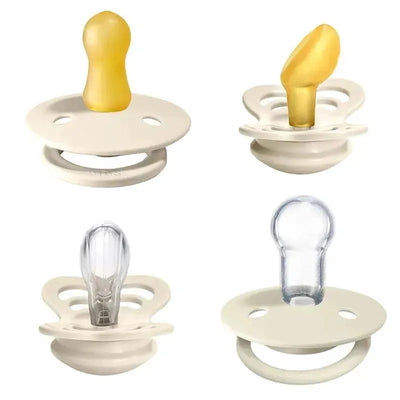 Four BIBS Try-it De Lux ivory pacifiers made of natural rubber and silicone, suitable for infants 0-6 months.