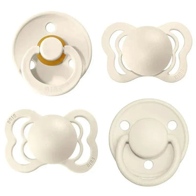 Set of four BIBS Try-it De Lux Ivory pacifiers made from natural rubber and silicone, suitable for infants 0 to 6 months.