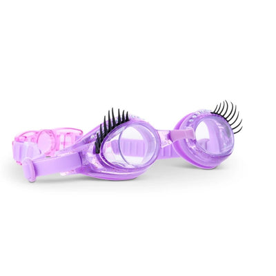 Purple swimming goggles with UV protection, featuring decorative black eyelashes and a pink adjustable strap.