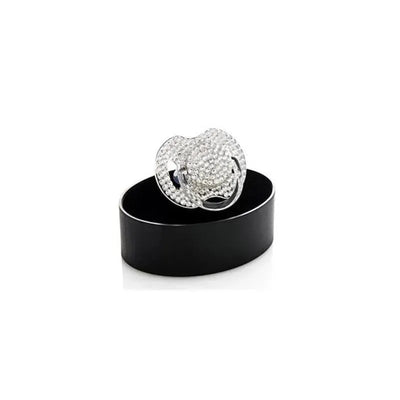 Bling Crystal Pacifier in crystal clear, adorned with rhinestones, on a black circular display. Suitable for ages 6 to 18 months.