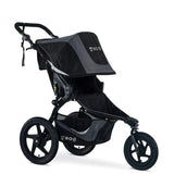 BOB Gear Revolution Flex 3.0 Jogging Stroller in Graphite Black with a large canopy and a storage basket underneath.