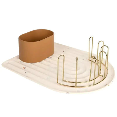 Boon ARC Silicone Baby Bottle Drying Rack in Boho Beige, featuring a textured mat and gold wire holders for bottles.