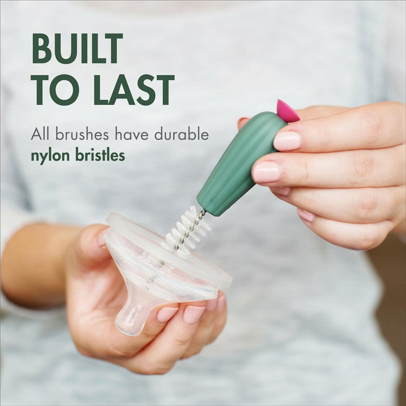 Boon Cacti Bottle Cleaning Brush Set, featuring a green brush with nylon bristles, cleaning a bottle nipple.