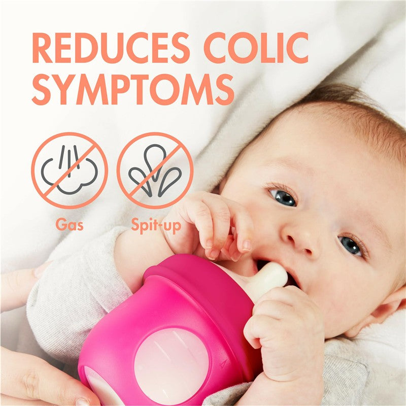 Boon NURSH pink silicone bottle being held by a baby; text highlights benefits: reduces gas and spit-up.