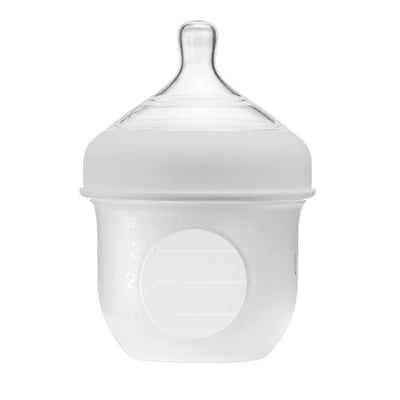 Light gray 4oz Boon Nursh silicone bottle with a clear nipple and measurement markings on the side.