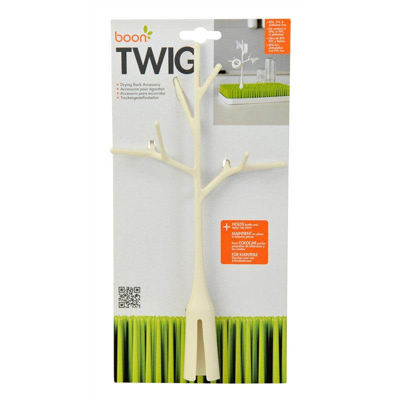 Boon TWIG drying rack accessory in white, designed to hold bottles and small items, with a branch-like structure on a product package.
