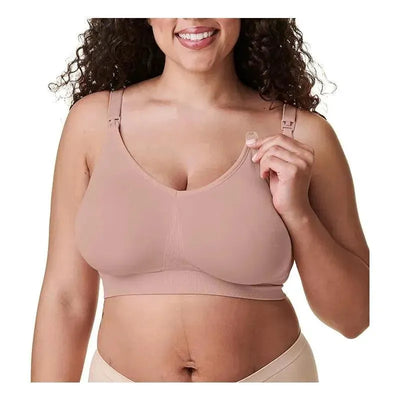 Body Silk Seamless Nursing Bra in cameo color, worn by a smiling woman, showing nursing clasp functionality.