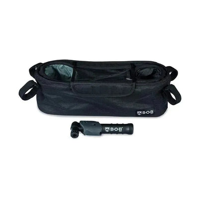Britax BOB Gear Deluxe Handlebar Console with a tire pump, featuring a spacious black console bag and pump accessory.
