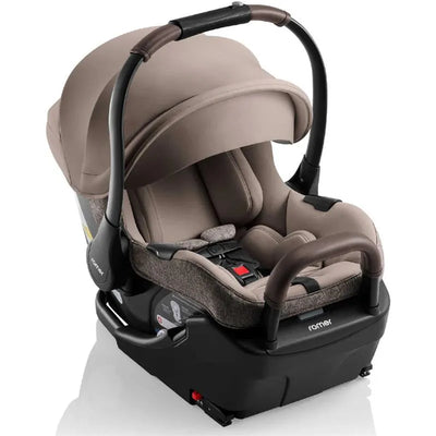 Romer Juni Infant Car Seat in Truffle color, featuring a removable canopy and padded harness for safety and comfort.