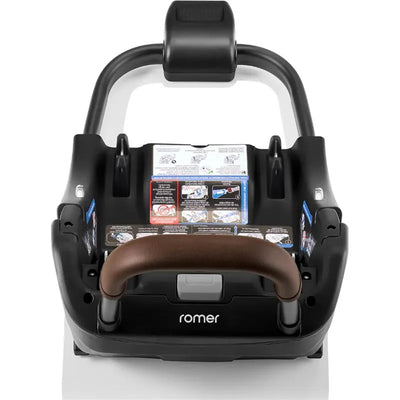 Romer Versa Extra Base for Juni with brown handle and instructional labels attached, showing installation guidelines.