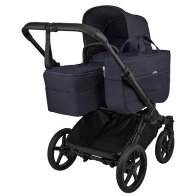 Bugaboo Donkey 6 Complete Stroller in Black and Deep Indigo, featuring a spacious bassinet and a large storage basket underneath.