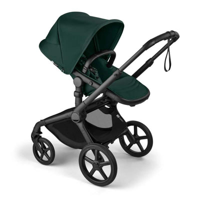 Bugaboo Fox 5 Renew complete bassinet and seat in black with fern green fabric, showcasing a modern stroller design.