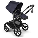 Bugaboo Fox 5 Renew Complete Bassinet & Seat in Deep Indigo, featuring a sleek design with black chassis and large wheels.