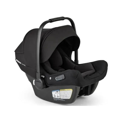 Bugaboo Turtle Air Shield by Nuna car seat in black, featuring a foldable handle, padded interior, and safety labels.