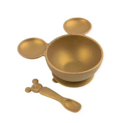 Gold Mickey Mouse-shaped silicone bowl with two side compartments and a matching spoon for feeding infants.