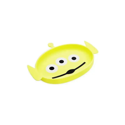 Silicone dish shaped like a Toy Story alien, featuring a bright yellow color, three black eyes, and a smiling mouth.