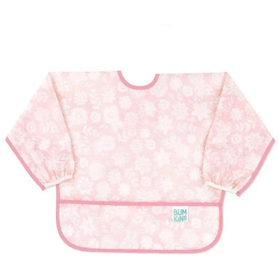 Bumkins sleeved bib in light pink with floral pattern and elastic cuffs, designed for mess-free eating and play.