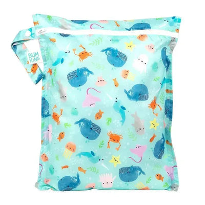 Waterproof wet bag by Bumkins featuring an ocean life pattern with colorful sea creatures.