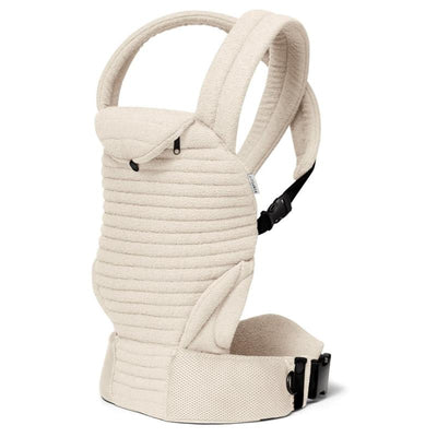 Bumpsuit The Armadillo Baby Carrier in Cloud color, featuring a textured fabric, padded straps, and adjustable buckles.