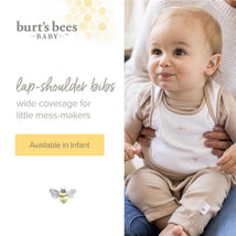 Burts Bees lap-shoulder bibs set for infants, featuring a child in a beige outfit and light-colored bib with bee designs.