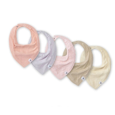Five organic cotton bandana bibs in pink, lavender, striped pink, beige, and cream colors.