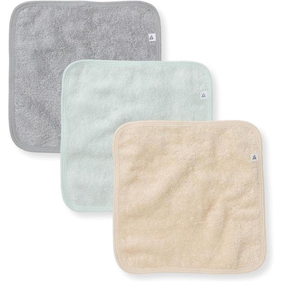 Three organic cotton baby washcloths in gray, mint green, and beige, featuring a soft knit terry texture.