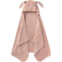 Hooded toddler towel in soft pink with bunny ears and facial features, made from organic cotton.