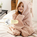 Burts Bees Organic Cotton Toddler Hooded Bunny Towel in soft pink, featuring bunny ears, worn by a smiling child.