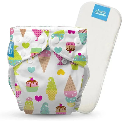 Reusable cloth diaper by Charlie Banana in gelato print with colorful ice cream and heart patterns, includes a removable insert.