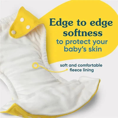 Reusable cloth diaper featuring a soft fleece lining, yellow snaps, and text highlighting edge softness for baby comfort.