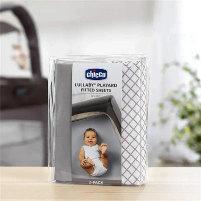 Chicco 2 Pack Lullaby Playard Sheets in grey diamond design, featuring packaging with a baby illustration and dimensions stated.