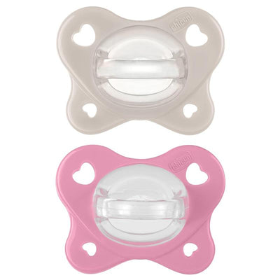 Physioforma Dual Soft Pacifier set in grey and dusty rose, designed for babies aged 6-16 months, featuring heart-shaped holes.