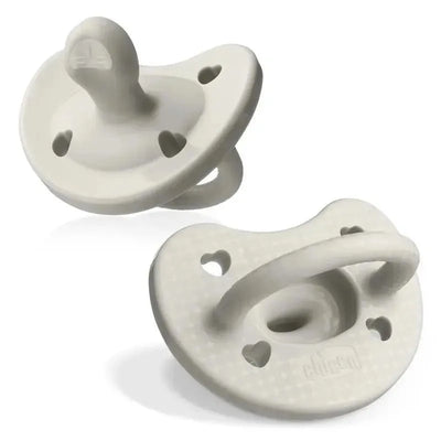 Chicco PhysioForma Luxe silicone pacifier for babies 0-6 months, in pearl grey, featuring heart-shaped ventilation holes.