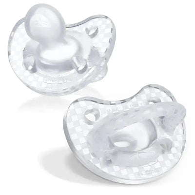 Chicco PhysioForma Luxe silicone pacifiers in crystal clear, designed for babies aged 16-24 months, featuring a one-piece construction.