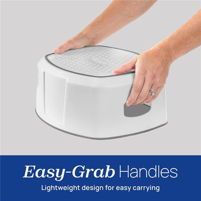 Chicco Single Step Stool with Easy-Grab Handles, lightweight design for easy carrying, shown being held by hands.